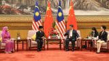 习近平会见马来西亚最高元首哈利姆
