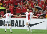 国足2：1逆转乌兹别克斯坦队 两连胜锁定小组头名