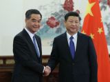 习近平分别会见来京述职的梁振英、崔世安