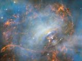 NASA发布蟹状星云图 中子星如“跳动的心脏”