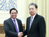 赵乐际会见越南共产党代表团