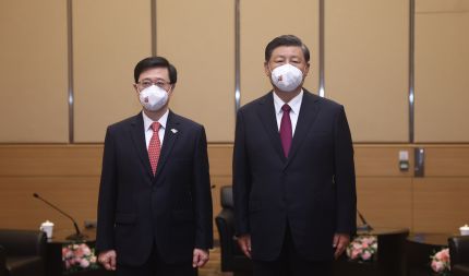 习近平会见李家超